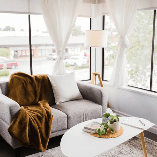 Bright, calming therapy office seating area with natural light