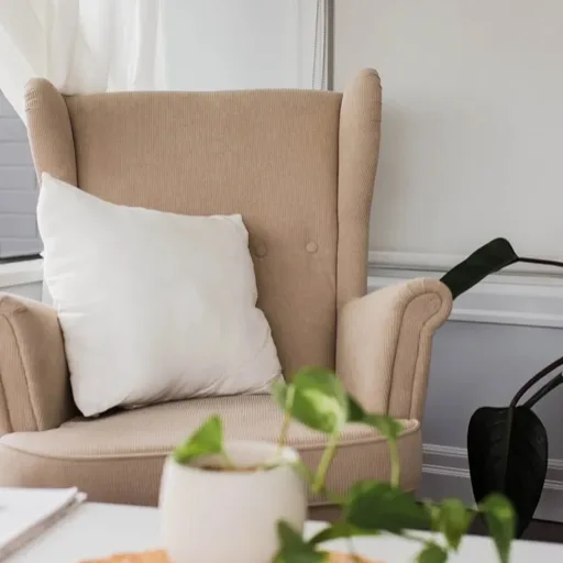 Comfortable wingback chair and soft furnishings in the practice space